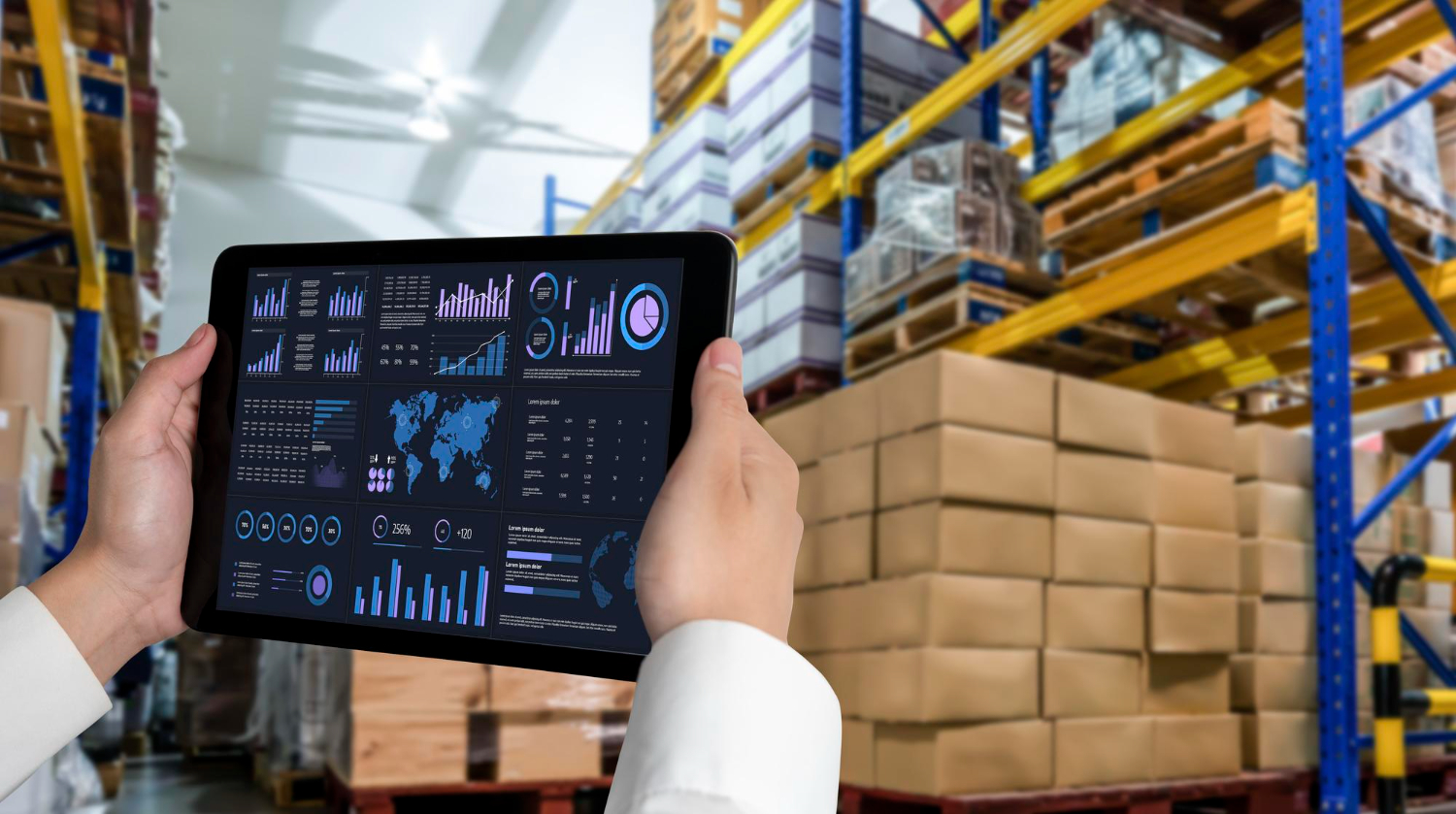 Worker in a warehouse holding a tablet